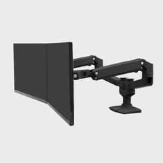 the monitor arm has two monitors on it, and one is attached to the wall