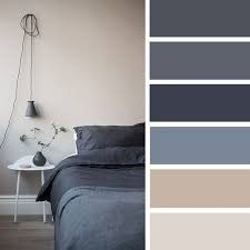 a bedroom with gray walls and grey bedding