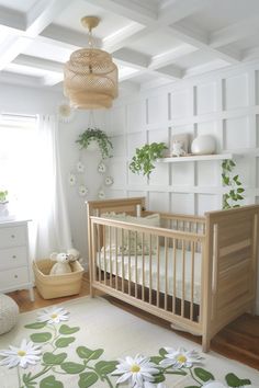 a baby's room with white walls and wooden furniture