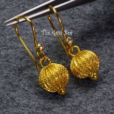 DESCRIPTION: Thank you for coming in! Spectacular 18K solid yellow gold earrings with old stock handmade high karat solid gold lantern earring pendants and rose cut diamond accents! Looks much much nicer in person! WEIGHT: 2.85 Grams DIMENSION: 1.35 Inch Total Length. MATERIAL: 18K Solid Yellow Gold, Diamond Traditional Yellow Gold Pendant Earrings, Pendant Earrings With Intricate Design In Yellow Gold, Yellow Gold Pendant Earrings With Intricate Design, Yellow Gold Pendant Earrings For Festive Occasions, Gold Fine Jewelry Earrings For Celebration, Traditional 14k Gold Earrings, Traditional Gold Diamond Cut Earrings, Traditional Handmade 14k Gold Earrings, Exquisite Gold Filigree Earrings