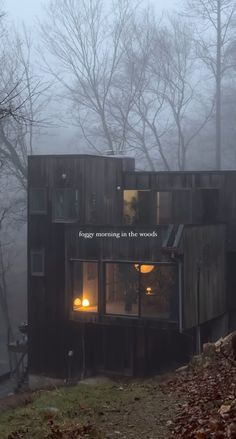 a house with the words fog morning in the woods