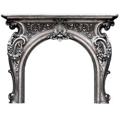 an ornate silver fireplace mantel with carvings on the front and sides, isolated against a white background