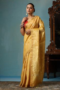 Light yellow gold handwoven saree crafted in kosa silk featuring flower and leaf motif. Comes with a running blouse piece. - Aza Fashions Gold Pre-draped Saree With Cutdana For Navratri, Gold Raw Silk Traditional Wear For Navratri, Traditional Gold Pre-draped Saree For Navratri, Gold Raw Silk Pre-draped Saree For Festivals, Gold Chanderi Traditional Wear For Transitional Season, Navratri Gold Chanderi Pre-draped Saree, Transitional Gold Chanderi Traditional Wear, Transitional Gold Traditional Wear In Chanderi, Gold Silk Traditional Wear With Cutdana