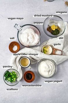 an overhead view of the ingredients needed to make homemade mayonnaise in small bowls