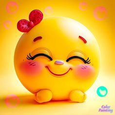 a cute little yellow ball with a red bow on its head and eyes, sitting in front of bubbles