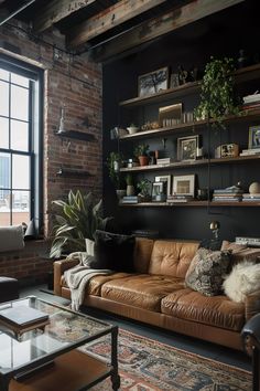 a living room filled with furniture and lots of shelves on the wall next to a window