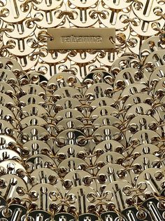 Paco Rabanne's 1969 Moon bag design is iconic and enduringChainmail effect. Polished finish. Single shoulder strap. Main compartment. Color: goldWidth: 20 cm Height: 11 cm Depth: 5 cmMaterial: 100% BrassGender: WOMENMaterial: 100% BRASSColor: GOLDMade in: IMPORTEDProduct ID: 23PSS0337 MET002 P711*Import tax/duty will be calculated at checkout (If applicable) Paco Rabanne Bag, Moon Bag, Oversized Tote Bag, Bag Design, Suit Accessories, Paco Rabanne, Beauty Accessories, Lace Boots, Bridal Shoes