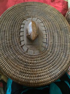 a woven basket with an animal head on it