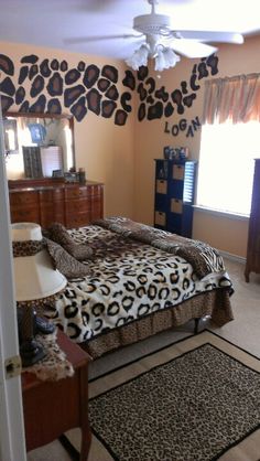 a leopard print bed spread in a bedroom