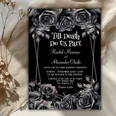 a black and white wedding card with roses