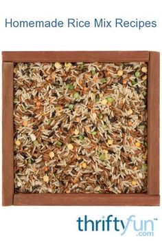 a wooden frame filled with lots of rice and nuts on top of brown grounding