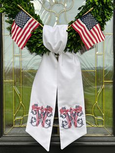 a wreath with two american flags on it