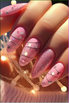 You have to see this list of pink Christmas nail ideas! The designs are classy and feature white and gold glitter that’s perfect for the season. They’re so festive and chic! Oval Nails Designs December, Ornament Nails Design, Crismas Nails Art, Pink Christmas Nails Almond, Chic Christmas Nails, Pink Christmas Nail Designs, Soft Nails