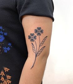 a person with a flower tattoo on their arm