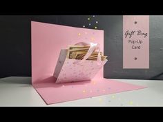 a gift bag pop up card with money in it