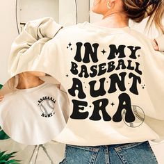 Support your niece or nephew at their next baseball game! This in my era shirt features a baseball and "baseball aunt" on the front pocket design and a retro inspired back that says "in my baseball aunt era." You're sure to be the cool aunt in this sweatshirt! Also great as a gift from niece, gift from nephew, gift for sister, or any gift for aunt, especially your favorite aunt. Your order is supporting a sports mama's small business. Thank you so much!  ♡ How to order ♡ Please select a color (a Baseball Season Fan Merchandise Sweatshirt, Casual Personalized Tops For Baseball Season, Casual Personalized Tops For Game Day, Baseball Aunt, The Cool Aunt, Front Pocket Design, Aunt Sweatshirt, In My Era, Aunt Birthday Gift