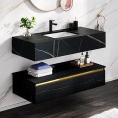 a bathroom vanity with black and gold accents