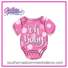 a pink baby bodysuit with polka dots on it