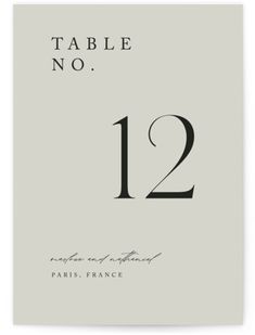 the table number card is shown in black and white, with an elegant calligraphy font