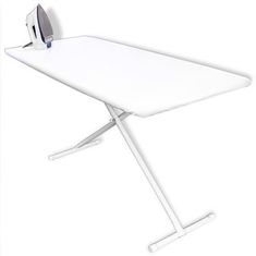 a white ironing board with an iron on it