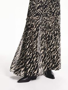 MO&Co. Women's Flowy Tiger Print Skirt This maxi dress is made from lightweight chiffon fabric. Features elegant ruched pleating details and an elastic waist, creating a flattering A-line silhouette. With a mini liner skirt included you can confidently show off the bold tiger pattern while feeling comfortable and stylish. Features : - Flowy maxi A-line silhouette- Sophisticated ruched pleated and elastic waist- Mini liner skirt included, tiger pattern Code: MBD3SKT042The back length of size S is Chic Skirted Dresses With Elastic Waistband, Casual Pleated Maxi Dress With Flowy Skirt, Chic Flowy Lined Maxi Dress, Flowy Ruched Tiered Skirt Maxi Dress, Chic Tiered Maxi Dress With Gathered Skirt, Chic Tiered Viscose Maxi Skirt, Chic Viscose Tiered Maxi Skirt, Chic Maxi Dress With Gathered Tiered Skirt, Flowy Maxi Dress With Gathered Skirt