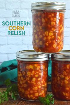 three jars filled with red beans on top of a wooden table