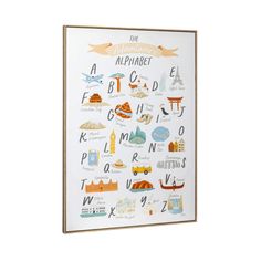 the illustrated alphabet poster is hanging on a wall