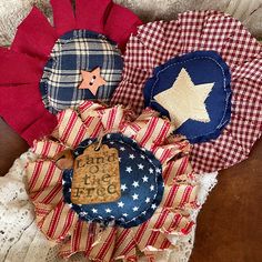 several patriotic items are sitting on top of each other, including a red white and blue pinwheel