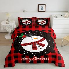 a red and black plaid christmas bed set with a snowman on the front cover