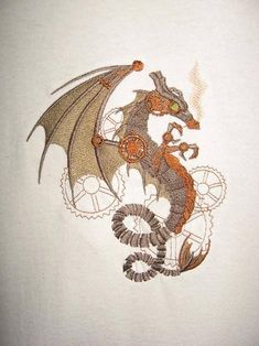 a dragon embroidered onto the side of a white shirt with an orange and black design