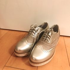 Never Worn Brand New (No Tag) Silver Shoes. Size 7. Very Cute. I Just Have So Many Shoes And Never Got To Wear Them Casual Party Oxfords With Brogue Detailing, Casual Oxfords With Brogue Detailing For Party, Casual Wingtip Oxfords For Party, Casual Brogue Oxfords For Parties, Synthetic Almond Toe Oxfords For Spring, Many Shoes, Shoes Size 7, Silver Shoes, Winter Rain