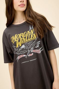 Attention, the demanded country star Morgan Wallen is officially on the roster. An unwavering fan group and massively popular, country charting singles have given a major rise to fame for the icon. Wallen’s song “Livin’ the Dream” lands in an eagle graphic stamped with his hometown. Swoop this fast. A blend of the Weekend Tee and OS Tee, this roomy fit t-shirt is like that perfect vintage find, featuring an open neckline and ladder stitch hems 100% cotton fabric, feels like a luxury tour shirt w Concert Fashion, Ladder Stitch, Tour Shirt, Fashion Tees, New Outfits, Sweater Shirt, Sweaters & Cardigans, Shirt Blouses, Jumpsuit Dress