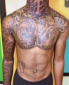 a man with many tattoos on his chest