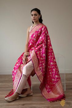 "This ravishing Banarasi dupatta is destined to become a family heirloom. A luxurious full-kadwa floral jaal which brings with it the best of Indian weaving heritage. A real trousseau treasure.\n\u00a0\n\n\n\n Color\u00a0-\u00a0A stunning shot colour with a warp of Red and a weft of Rani Pink\n\n Technique\u00a0-\u00a0An enduring Kadwa weave. The elaborate and laborious Kadwa (Kadhua) technique involves hand-weaving each motif separately. It takes longer on the handloom, but makes a more robust pattern, which stands out on the fabric.\u00a0\n\n Fabric\u00a0- Soft as butter, pure Katan silk\n\n Speciality\u00a0- \u00a0Luxury is in the details. This is a painstakingly handwoven dupatta with a rich and intricate weave in gold and silver zari in breathtaking Banarasi opulence.\n\n Tilfi Promis Luxury Handloom Dupatta For Rituals, Luxury Handloom Cotton Silk Dupatta, Luxury Katan Silk Block Print Dupatta, Cheap Festive Katan Silk Dupatta, Cheap Unstitched Katan Silk Traditional Wear, Luxury Silk Dupatta With Zari Weaving, Rani Pink, Katan Silk, Family Heirloom