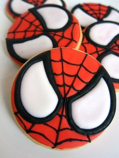 decorated cookies in the shape of spiderman's eyes