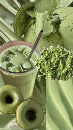 an assortment of green foods including doughnuts, ice cream and sprinkles