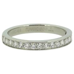 Here we have a classically styled diamond half-eternity ring from the world renowned luxury jewellery house of Cartier. This platinum piece features 17 round brilliant cut diamonds in a single line formation; all which have been individually claw set amidst a neat channelled bordering above and below. Condition: Used (Very Good) Weight: 3.0 grams Ring Size: J (49) Band Width: 2.5mm Total Diamond Weight: Approx. 0.25ct Diamond Details: Approx. Colour: F-G, Clarity: VS Marked: 'Cartier' '49' 'Pt950' & Serial Number RRP: £4,400 Documents: Cartier Certificate of Authenticity Box: Plain Gift Box Vintage Cartier Watch, Half Eternity Ring Diamond, Full Eternity Ring, Luxury Jewellery, Half Eternity Ring, Modern Ring, Eternity Ring Diamond, Diamond Eternity, Cartier Ring