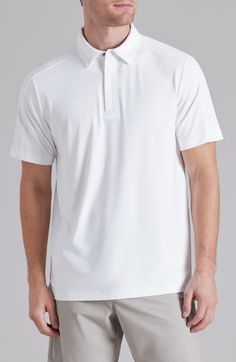 Cut from a lightweight, high-stretch knit, this polo is designed to keep you moving in comfort no matter what the day's activity brings your way. 28 1/2" length (size Medium) Covered quarter zip with snap closure Spread collar Short sleeves 88% nylon, 12% elastane Machine wash, tumble dry Imported White Breathable Casual Polo Shirt, Casual White Breathable Polo Shirt, Athleisure Moisture-wicking Collared Polo Shirt, Moisture-wicking Collared Polo Shirt For Athleisure, Casual White Stretch Polo Shirt, Moisture-wicking Athleisure Polo Shirt, Casual Go-dry Polo Shirt For Golf, White Casual Polo Shirt With 4-way Stretch, Classic Sports Top With 4-way Stretch