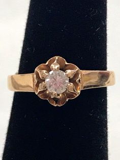 Vintage 14K Yellow Gold 1/4 CT ROUND DIAMOND Flower Engagement Ring Beautiful! Gorgeous ring! * Crafted in solid 14K yellow gold, the ROUND cut center diamond is approximately .25ct. G/H color. * Very pretty ring! * 2.3 grams * Size 6.75 with sizer (there is a sizer in ring band)  * Will ship Insured Yellow Gold Solitaire Diamond Flower Ring, Classic 14k Stamped Yellow Gold Flower Ring, Formal 14k Gold Flower Diamond Ring, Yellow Gold Flower Ring With Single Diamond, Black Opal Pendant, Flower Engagement, Locket Ring, Sterling Silver Wedding Band, Flower Engagement Ring