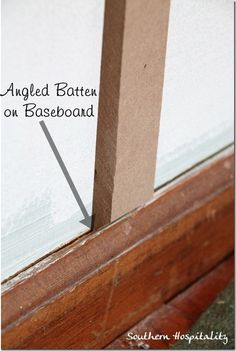 an angled batten on baseboard is shown with the bottom section missing from it