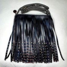 Elevate Your Style With This Chic And Eco-Conscious Stella Mccartney Crossbody Bag. Made From Premium, Cruelty-Free Materials, This Fabulous Bag Perfectly Blends Sustainability With Modern Fashion. The Fun Design Features Black Fringes With Studs And A Chain Strap, Making It Perfect For A Night Out Or A Rock Concert! - Color: Black - Material: Vegan Leather - Strap: Metal Chain - Interior: Includes A Large And Small Compartments - Condition: New With Tags Add This Stella Mccartney Crossbody To Y Edgy Crossbody Party Bag, Edgy Crossbody Bag For Party, Edgy Party Crossbody Bag, Edgy Black Bag With Silver-tone Hardware, Edgy Black Bags With Silver-tone Hardware, Edgy Shoulder Bag For Party, Black Shoulder Bag With Removable Pouch For Fashion, Edgy Evening Shoulder Bag With Silver-tone Hardware, Black Shoulder Bag With Palladium Hardware For Party