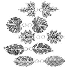 four metal leaves with chains attached to them, all in different shapes and sizes on a white background