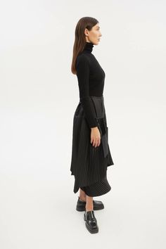 Discover the versatility of our Asymmetric A-Line Midi Skirt in timeless black. This skirt features layered pleated sections and unique detachable pockets, offering both style and functionality. With the option to change the silhouette, you can create a variety of distinct looks. From casual to sophisticated, this black midi skirt is a fashion-forward addition to your wardrobe, ready to adapt to your individual style.This item is Made-to-Order. Please allow us from 2 to 5 working days to make yo Black Midi Skirt, Black Midi, Pleated Midi Skirt, Individual Style, Fashion Forward, Midi Skirt, A Line, Velvet, Skirt