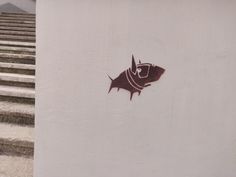 a fish on the side of a building