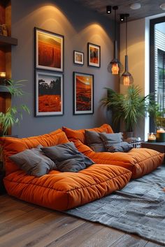 a living room filled with furniture and pictures on the wall