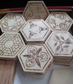 several wooden boxes with designs on them