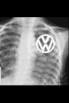 a black and white photo of a vw logo on the side of a shirt