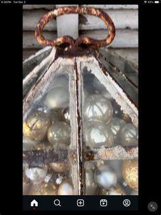 an old metal lantern with glass balls in it