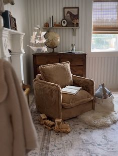 a living room filled with furniture and a fire place next to a window on top of a rug