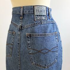 Vintage 90s classic jeans mini skirt for casual trendy women. This pencil jeans skirt is slim fit and high waist, it has side pockets. The minimal style denim skirt is very comfy for total looks. The skirt is cotton fabric, by Pamir Jeans, and it's excellent vintage conditions The estimated modern size is M/L, depending on waist contour fit 29,9 inch. (76 cm) ** MEASURES FLAT ** Waist 14,9 in // 38 cm Hip 19,6 in // 50 cm Length 21,6 in // 55 cm Reference: Model size S (4/6 US - height 65 in) Re Classic High Waist Denim Skirt In Blue, Classic Mid-rise Denim Blue Denim Skirt, Classic Mid-rise Denim Blue Skirt, Classic High Rise Denim Skirt With Pockets, Classic High Rise Denim Skirt For Summer, Classic High Rise Dark Wash Denim Skirt, Fitted High Rise Classic Denim Skirt, Classic High Waist Dark Wash Denim Skirt, Classic Straight Leg Denim Skirt With Pockets